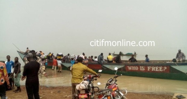 Travelers in a boat to cross the Volta Lake.