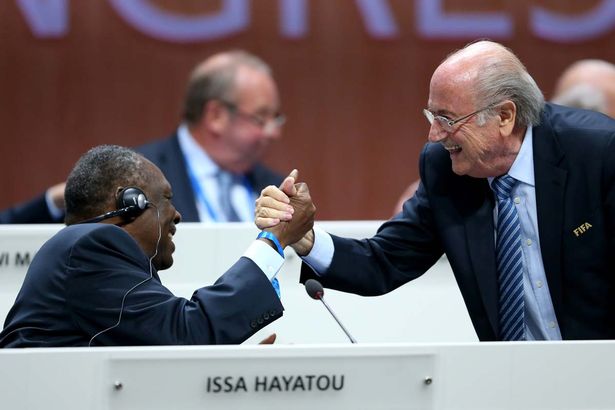 Ex FIFA President Sepp Blatte in a handshake with CAF Head Issa-Hayatou.