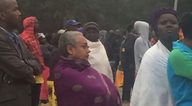 Kenya’s First Lady waits in line like other voters to cast her ballot