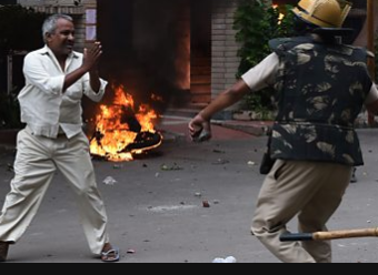 India guru rape case: 12 die in unrest as Ram Rahim Singh convicted