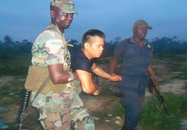 Anti-galamsey taskforce dragging away an asian believed to be involved in galamsey 