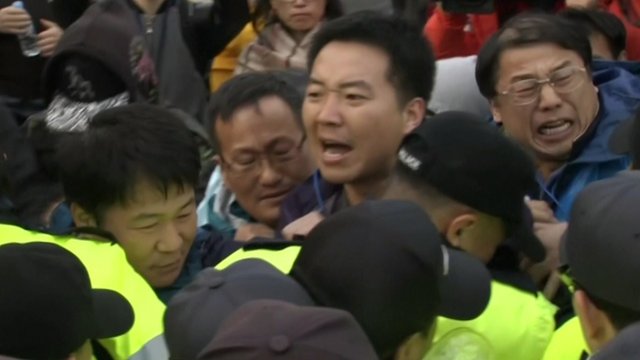 Angry South Korea families protest over slow ferry rescue