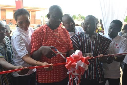 Kwame Osafo-Amoah, Airtel Zonal Business Manager- Northern Ghana (middle) being aided by Hannah Agbozo, Legal & Corporate Affairs Director- Airtel Ghana and Hon. Dominic Ayine, MP for Bolgatanga East (2nd from right) to officially commission the new classroom block