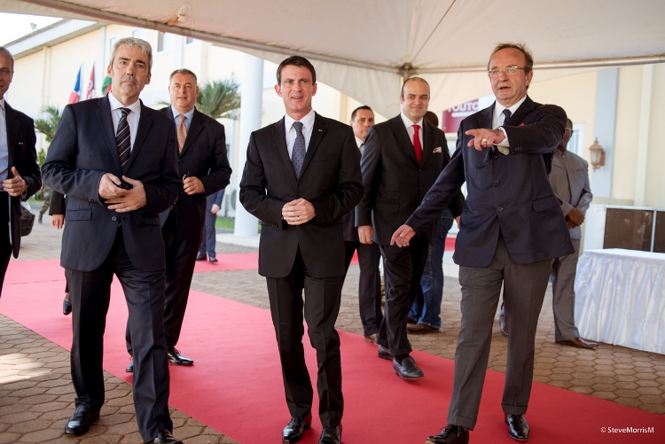 CEO of CTPC(R), Patrick Davailleau, making a gesture to the Prime Minister of France, Manuel Valls (M). With them is the CEO of Touton Group, Patrick de Boussac (L).