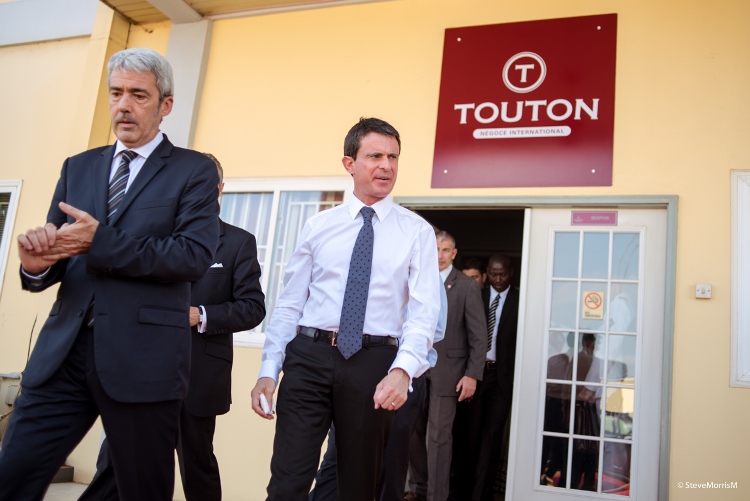 The Prime Minister of France, Manuel Valls (L) departing the company’s building with other dignitaries.