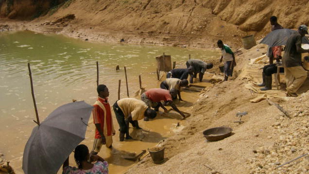 Miners working near the Birim River