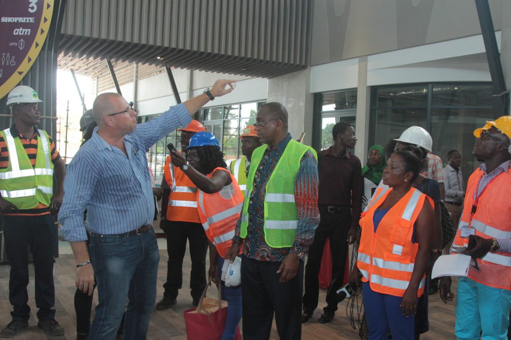 Mr. Gerber explains a point about the architecture to journalists as Chairman Kofi Sekyere looks on during the facility tour by Kumasi media practitioners