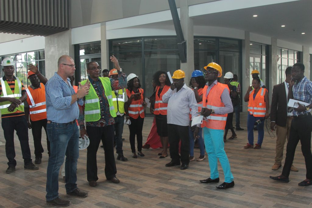 Mr. Gerber explains a point to Mr. Kofi Sekyere during the facility visit of the Kumasi media