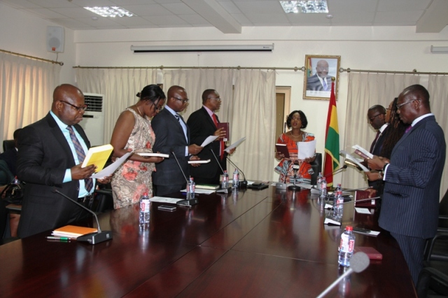 Deputy Minister of Finance, Mrs. Abena Osei Asare, administers the Oath of Office for the nine-member Board 