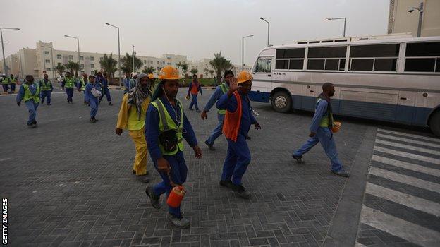 _98682022_qatar-workers